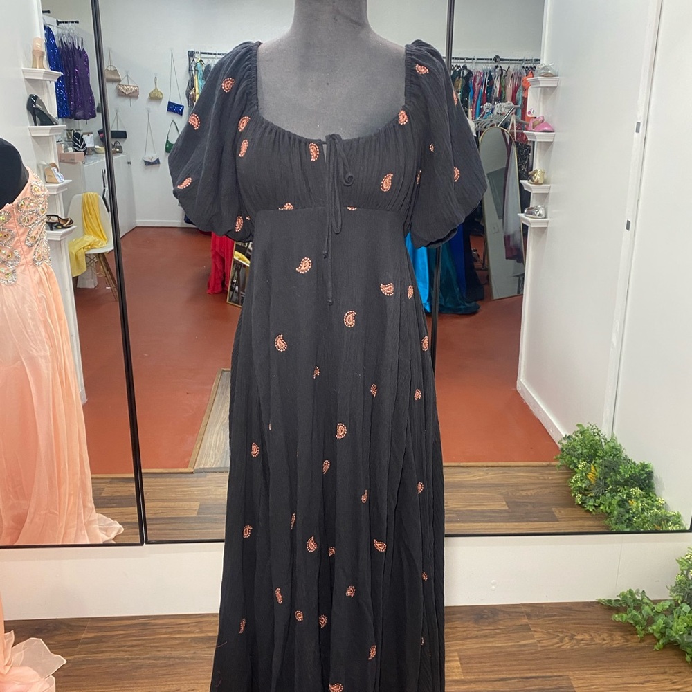 A beautiful black maxi dress with accents